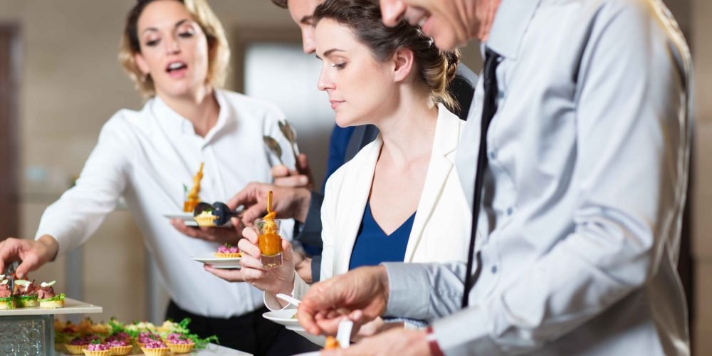 business-people-serving-themselves-with-snacks_11zon